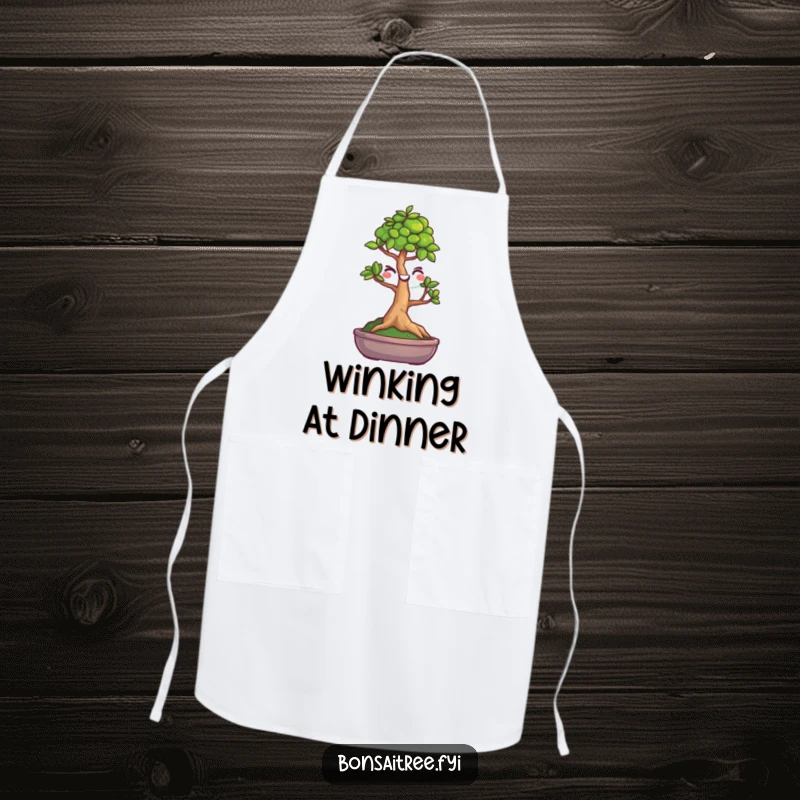 Funny cooking apron featuring a winking bonsai tree design, perfect for adding humor to the kitchen.