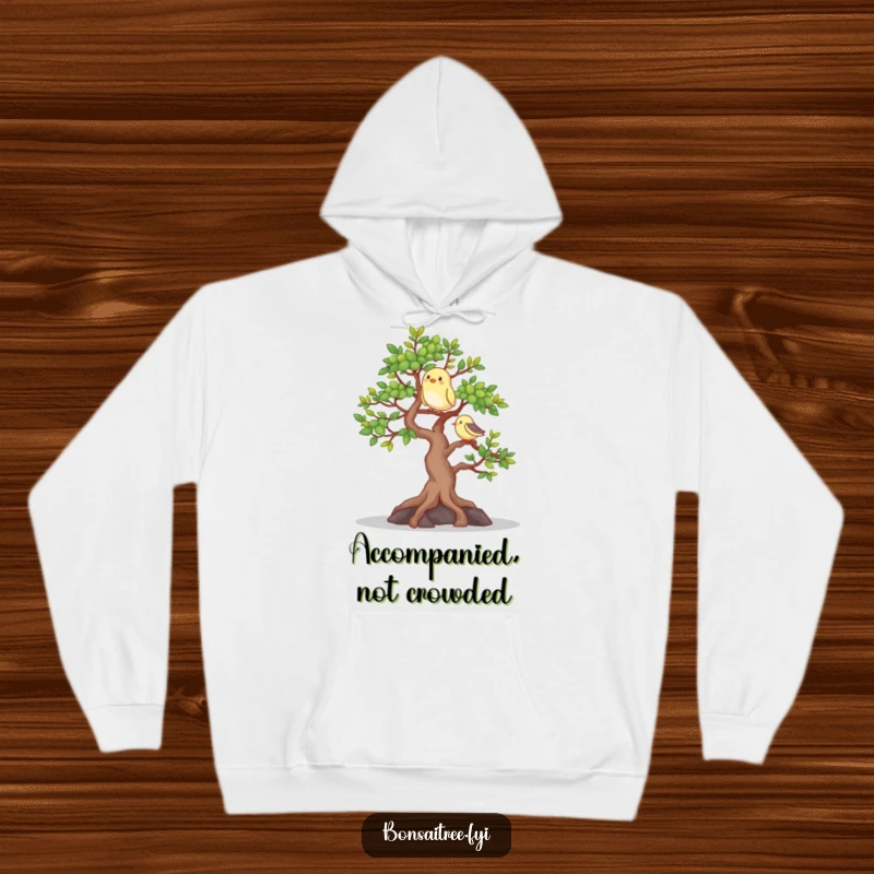 Funny hoodie featuring a happy bonsai tree with a bird companion, offering warmth and a touch of natural charm and humor.