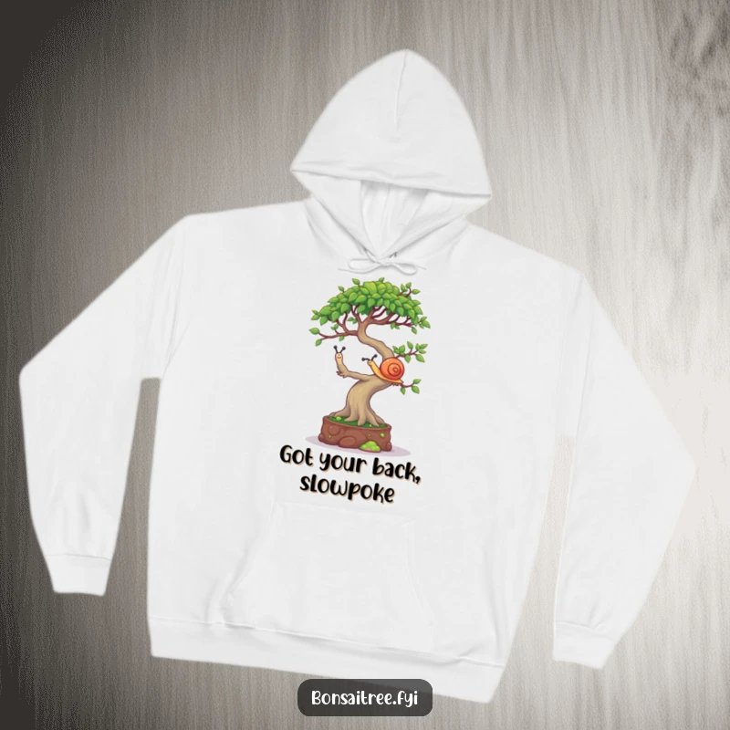 Funny Bonsai Tree Hoodie: A mischievous bonsai character attempting to balance a tiny snail on its canopy, perfect for cozy fun.