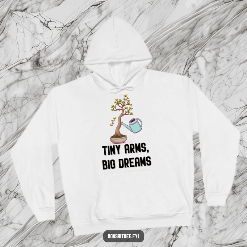 Funny hoodie featuring a determined, tiny bonsai tree struggling to lift an absurdly large watering can, radiating pure comic struggle.