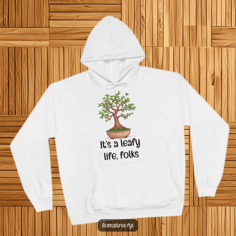Funny Bonsai Tree Hoodie: Cozy apparel featuring a bonsai tree in the act of juggling its own delicate leaves.