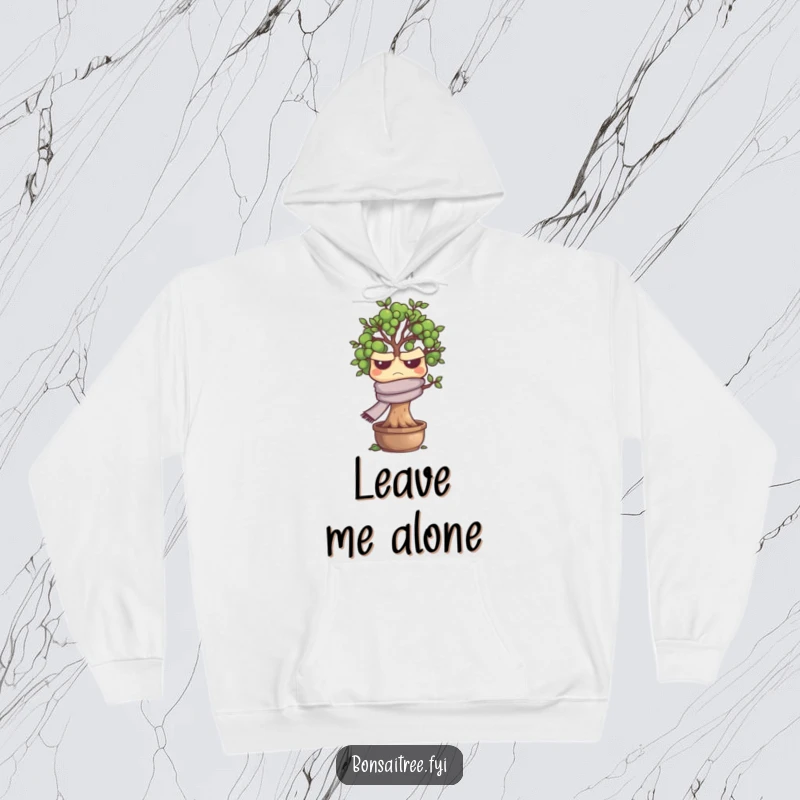 Funny grumpy bonsai tree character in a scarf, featured on a warm hoodie, offering a humorous and cozy feel.