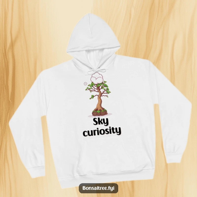 Funny hoodie depicting a curious bonsai tree character looking up at a cotton ball, evoking a sense of wonder and comfort.