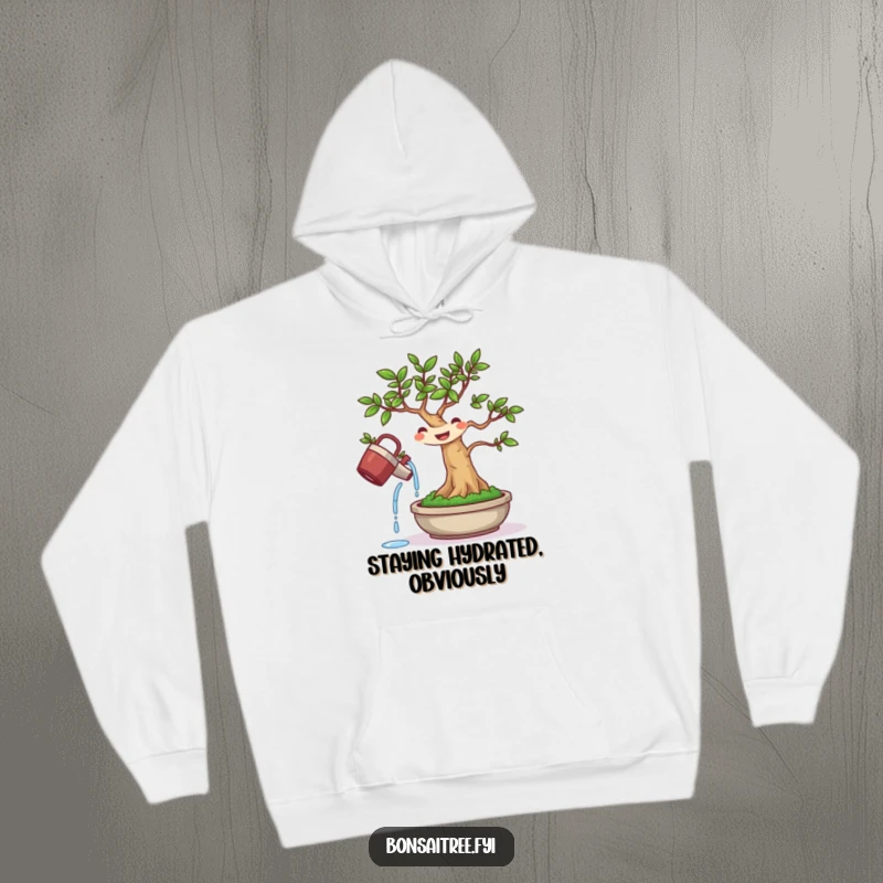 Funny hoodie showcasing a determined bonsai tree character watering itself, radiating self-care and a humorous attitude.