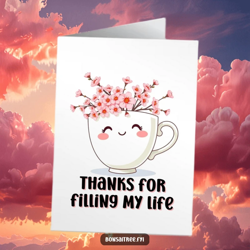 Free Printable Thank You Card: A smiling teacup character filled with miniature cherry blossoms, sending warm thanks, easy to print.