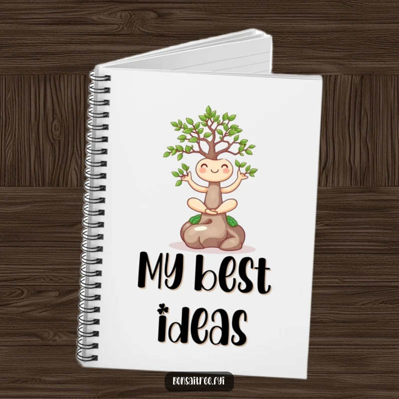 Funny notebook with a smiling bonsai tree in a yoga pose on the cover, perfect for mindful note-taking and journaling.