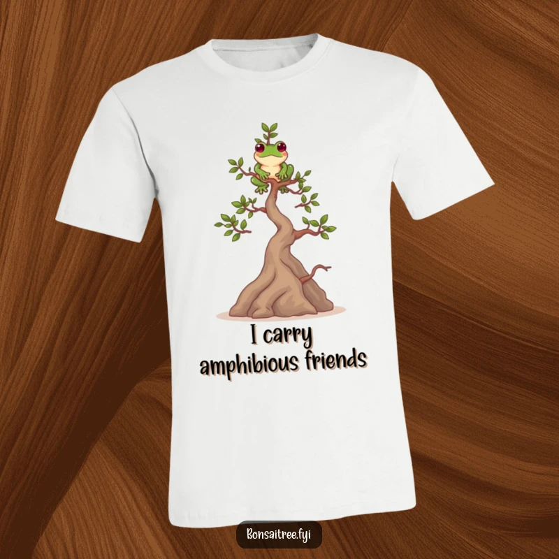 Funny t-shirt with a playful bonsai tree character balancing a green frog on its highest branch, a symbol of balance.